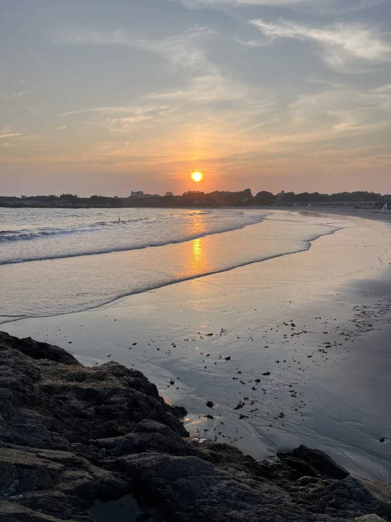 Cliff Walk at sunset overlooking Bailey's Beach and Rejects Beach